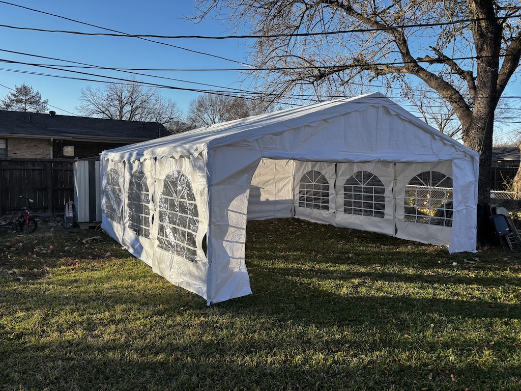 Enclosed frame tent with arched window sidewalls