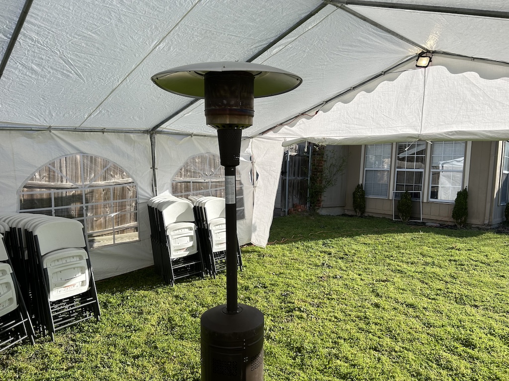 Patio heater inside frame tent for cold weather events