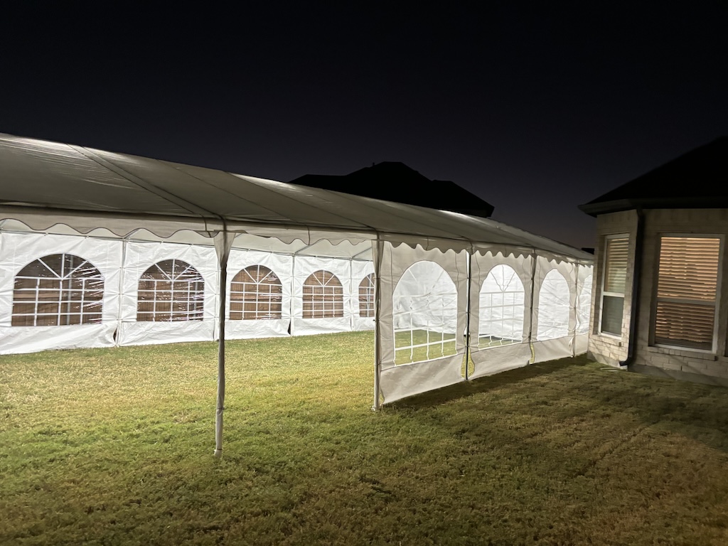 Frame tent with interior lighting at night